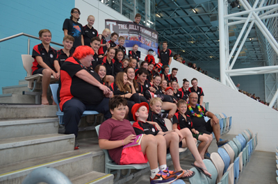 swim team sitting watching on