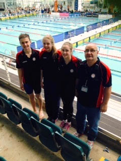 image of all swimmers on diving blocks
